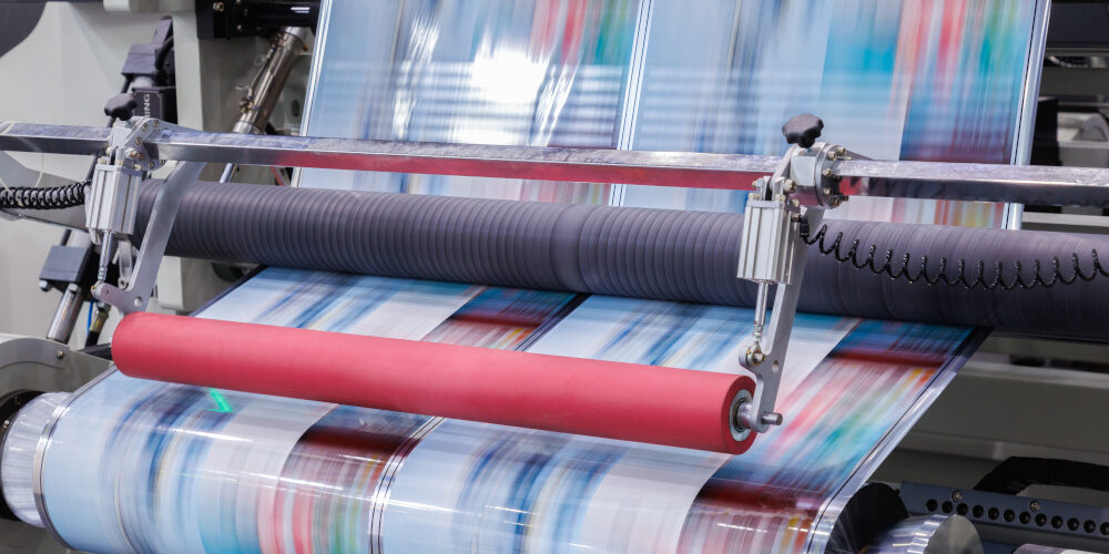 new innovative technology of automatic label printing machine with digital control panel. printing on continuous plastic film for wrapping on food product packaging in the printing factory. Help with plastic packaging tax by Trademark Polythene UK